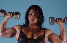 Buff Tina Rock posing in black lace lingerie 